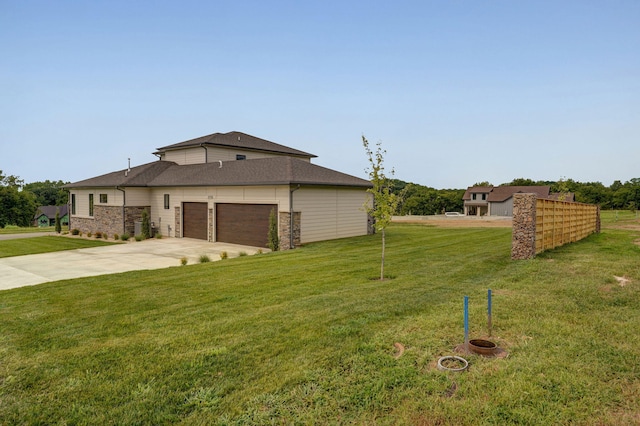 exterior space featuring a garage and a front yard