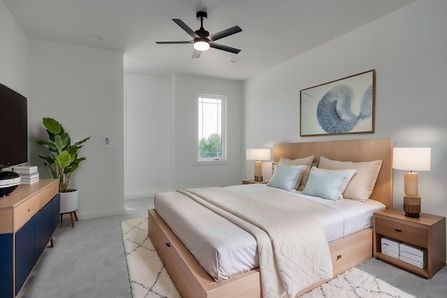 bedroom with light carpet and ceiling fan