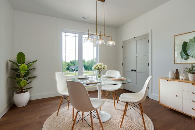 dining room with dark hardwood / wood-style floors