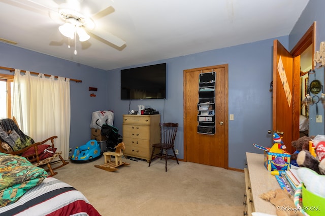 carpeted bedroom with ceiling fan