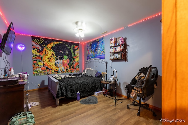 bedroom featuring hardwood / wood-style flooring