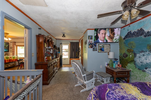 carpeted bedroom with ornamental molding, a textured ceiling, and ceiling fan