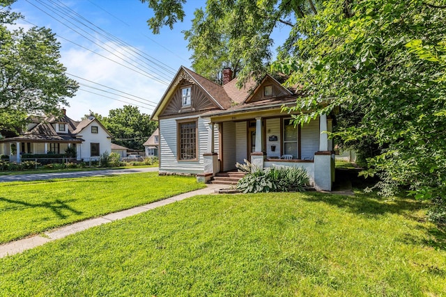 view of front of home featuring a porch and a front lawn