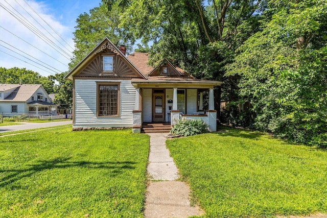 view of front of home with a front lawn and covered porch