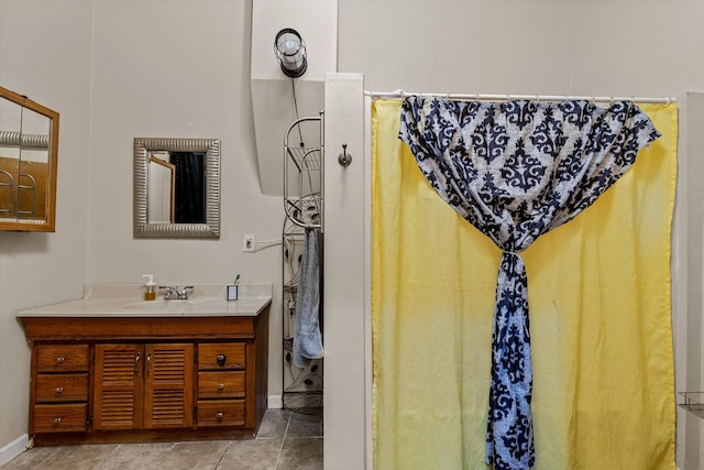 bathroom featuring tile patterned flooring and vanity