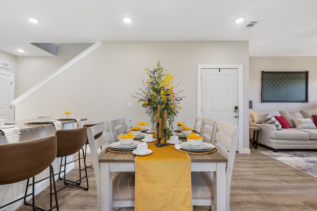 dining space featuring wood-type flooring