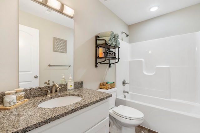 full bathroom with vanity,  shower combination, and toilet