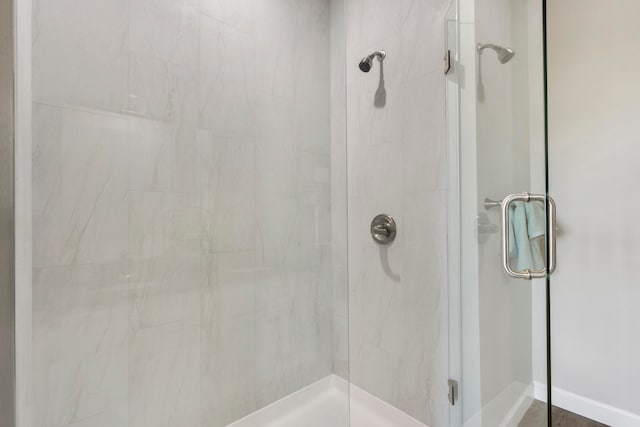 bathroom with a shower with shower door