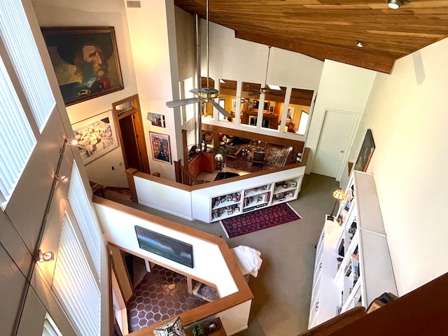 interior space featuring ceiling fan, wood ceiling, and high vaulted ceiling