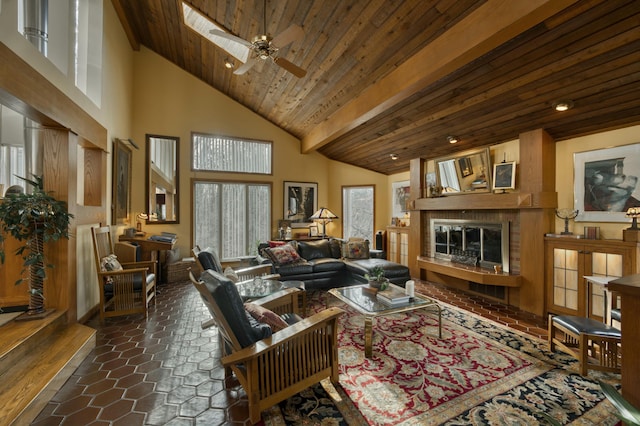 living room featuring ceiling fan, wood ceiling, and a towering ceiling