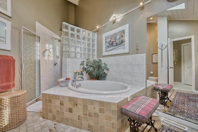 bathroom with tile patterned flooring and plus walk in shower