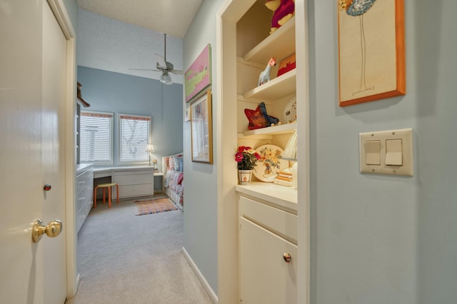 interior space with ceiling fan and vanity