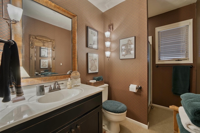 bathroom with toilet and vanity