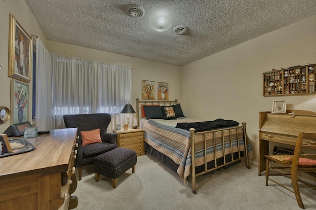 carpeted bedroom featuring a textured ceiling