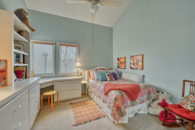 carpeted bedroom with ceiling fan, a textured ceiling, and lofted ceiling