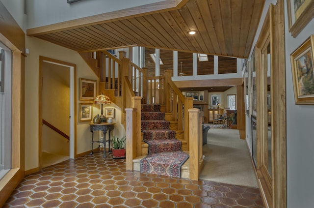 stairway featuring wood ceiling