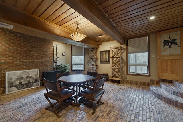 dining area featuring beam ceiling and wood ceiling