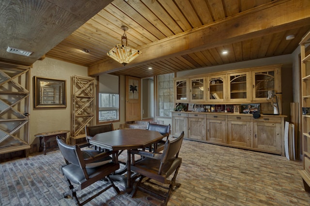 dining area with wood ceiling and beamed ceiling