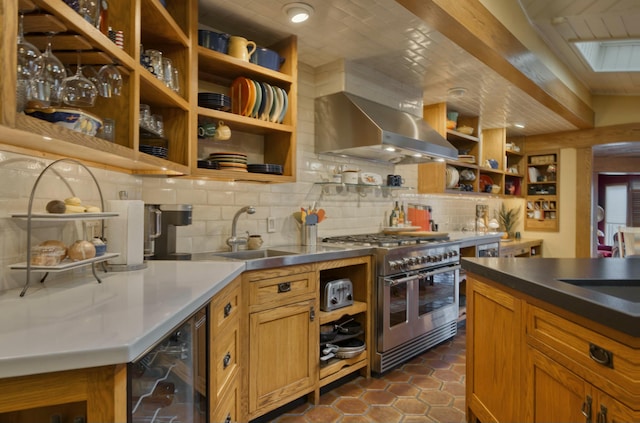 kitchen featuring double oven range, island exhaust hood, decorative backsplash, beverage cooler, and dark tile patterned flooring