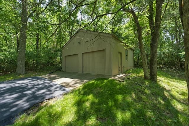 garage featuring a lawn