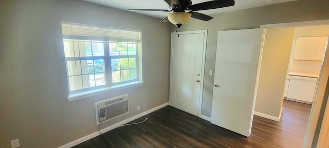 interior space featuring ceiling fan, dark wood-type flooring, and a wall mounted air conditioner