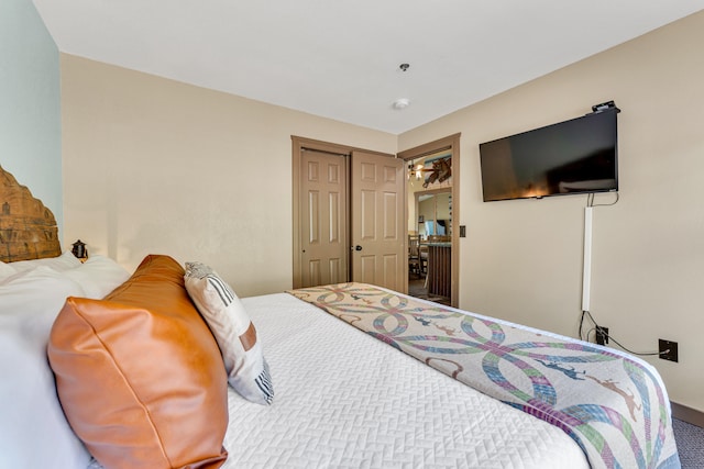 carpeted bedroom featuring a closet