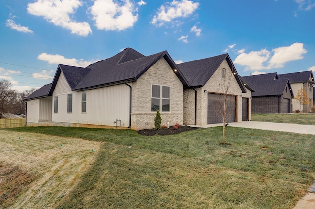 view of side of property featuring a yard and a garage