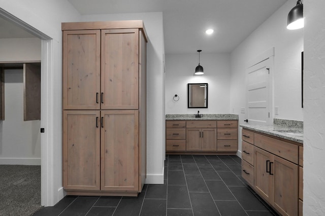 bathroom with tile patterned flooring and vanity