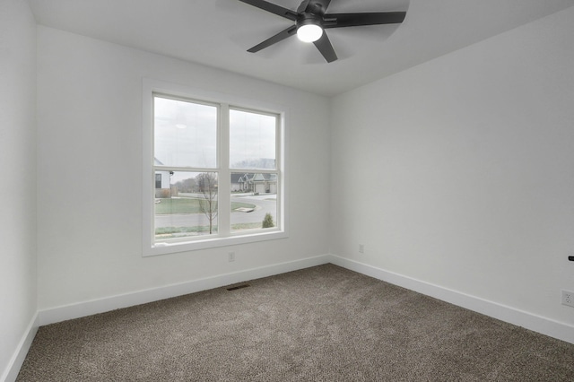 empty room with carpet and ceiling fan