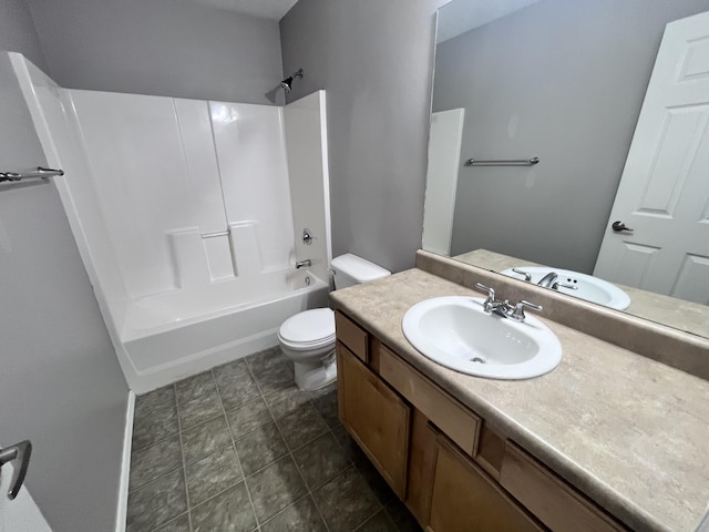 full bathroom featuring tub / shower combination, vanity, and toilet