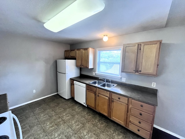 kitchen with sink and white appliances