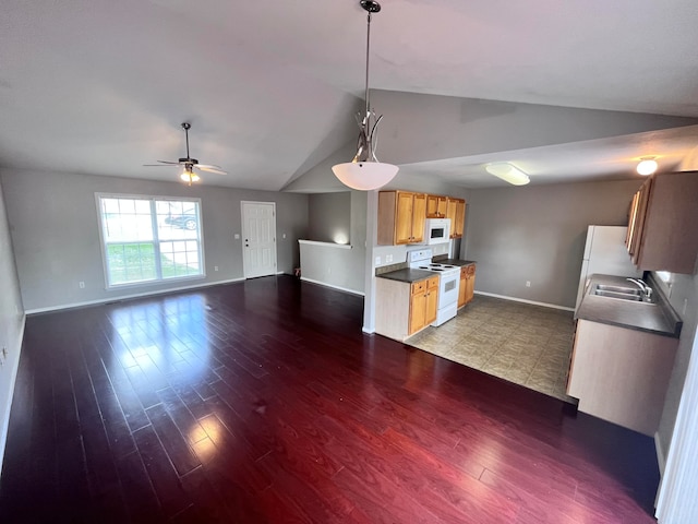 kitchen with ceiling fan, lofted ceiling, white appliances, decorative light fixtures, and dark hardwood / wood-style floors