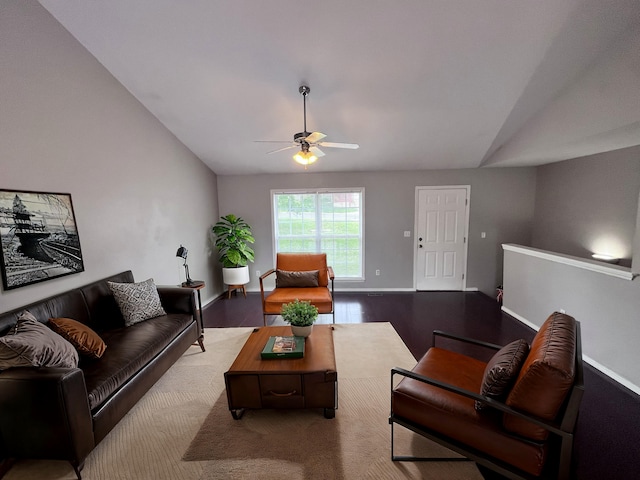 living room featuring lofted ceiling, ceiling fan, and wood-type flooring