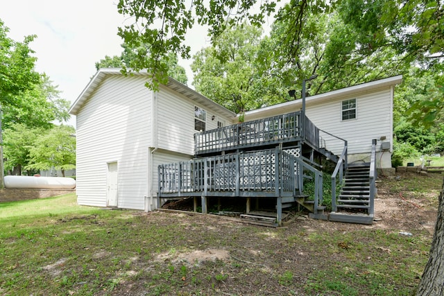 rear view of house featuring a deck