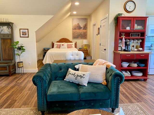 bedroom with hardwood / wood-style floors