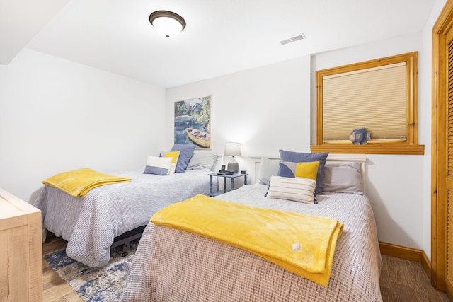 bedroom featuring wood-type flooring