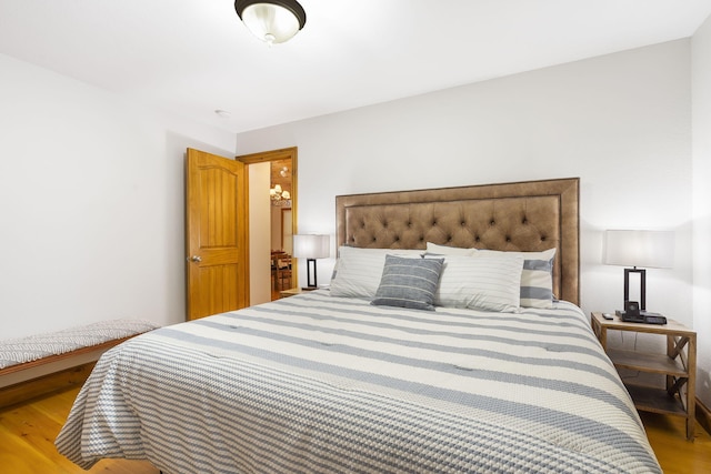 bedroom with wood-type flooring