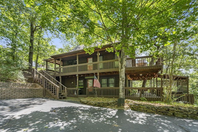 log-style house featuring a deck