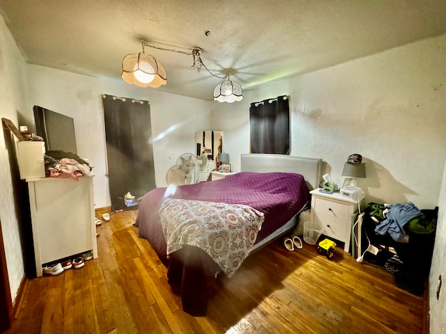 bedroom featuring hardwood / wood-style flooring