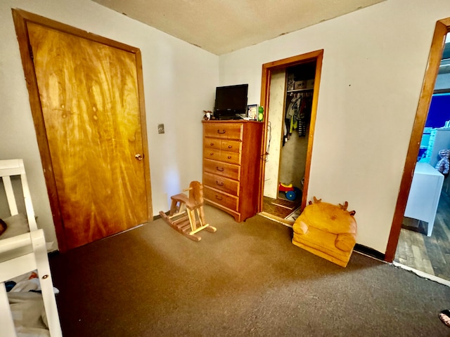 unfurnished bedroom with a closet and carpet