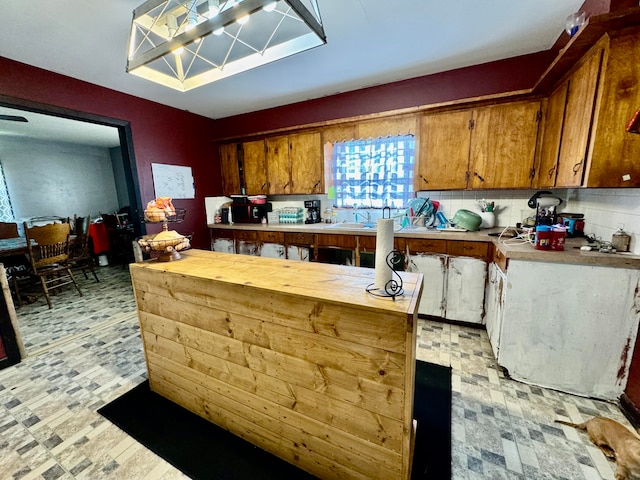 kitchen with tasteful backsplash and sink