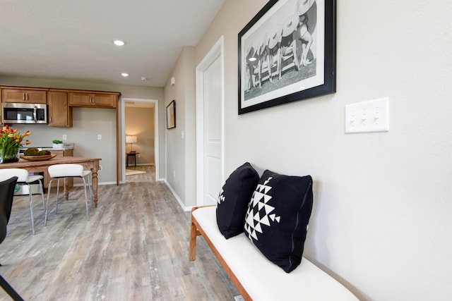 corridor featuring light hardwood / wood-style floors