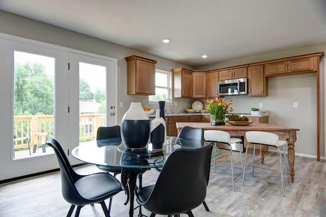 dining room featuring light hardwood / wood-style floors