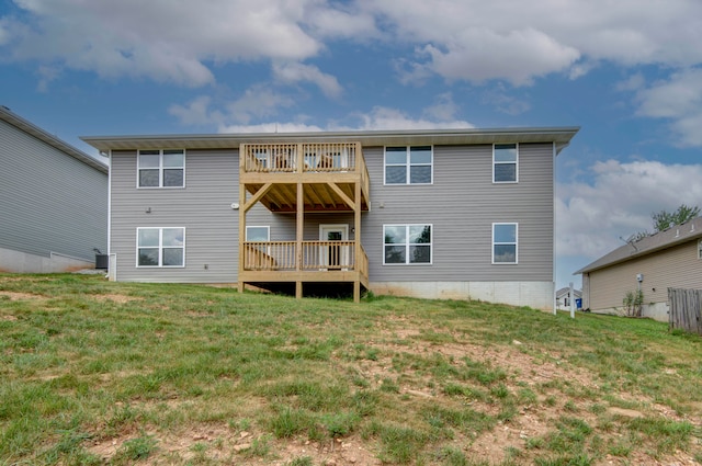 rear view of house featuring a wooden deck, a lawn, and a balcony