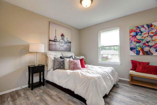 bedroom with wood-type flooring