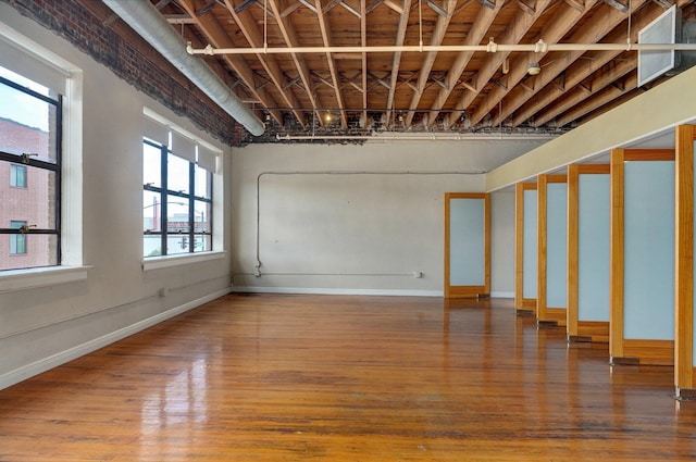 basement featuring hardwood / wood-style floors