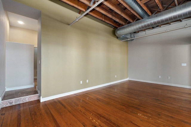 basement with dark wood-type flooring