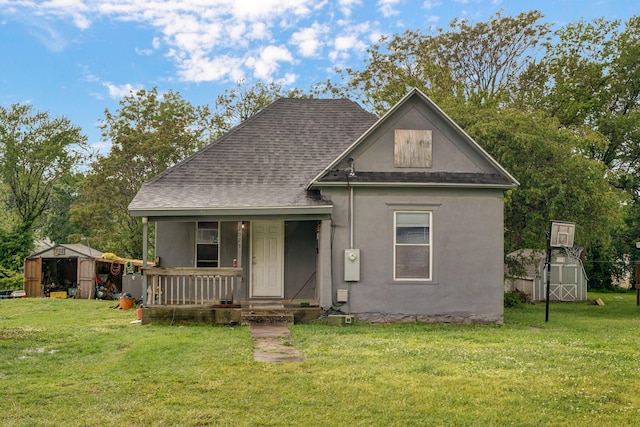 view of front of property with a front lawn and a storage unit