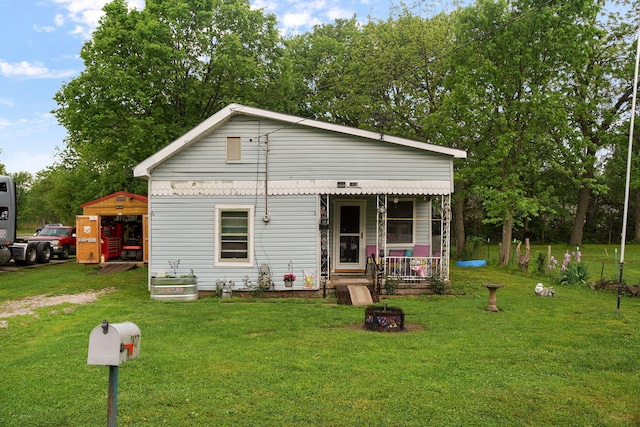 bungalow-style home with a front lawn and a porch