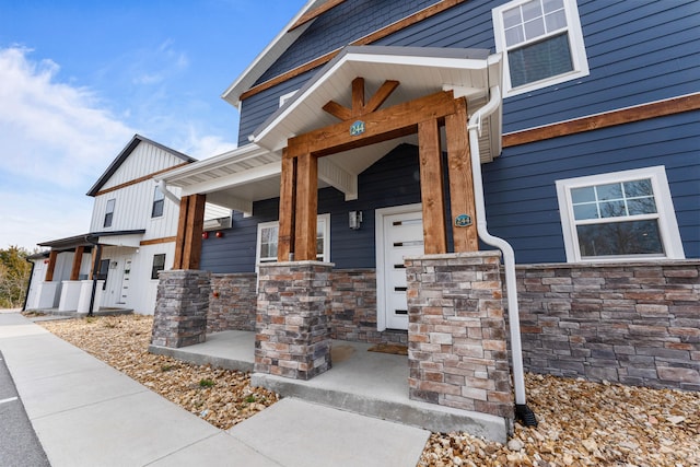 doorway to property with covered porch